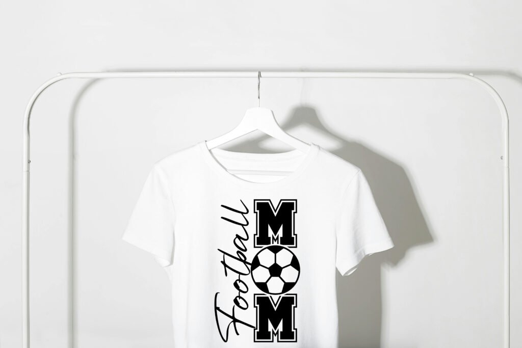 “A stylish Football Mom SVG design featuring bold lettering with a football graphic, perfect for shirts, mugs, and crafts.