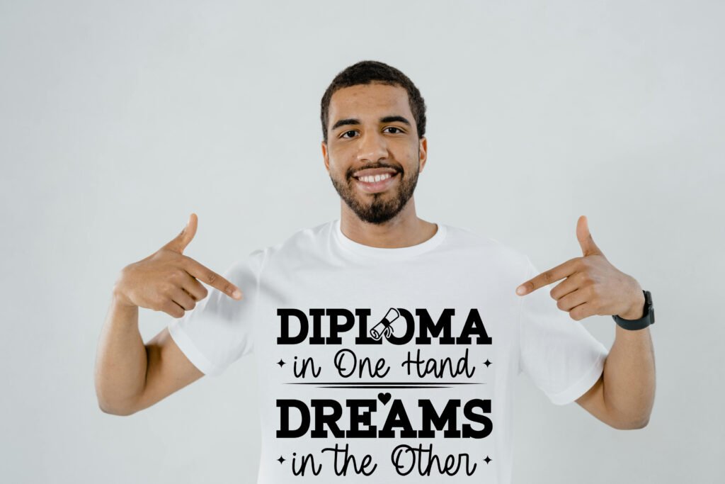 Graduation SVG Quote Diploma in one hand Dreams in the other design featuring inspiring text for graduates.