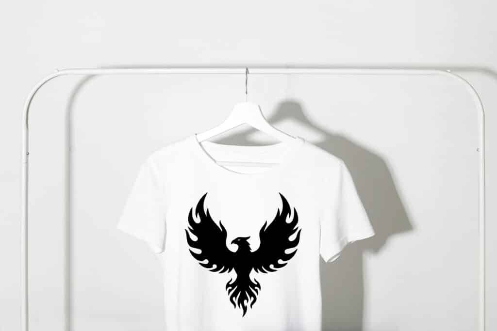 Phoenix silhouette svg showing a mythical fire bird with wings spread in a clean black vector silhouette.
